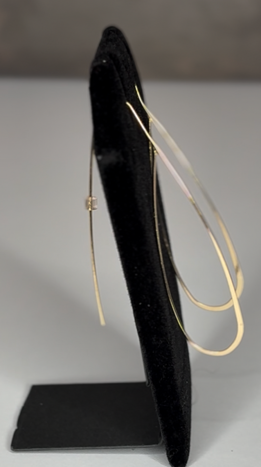 Pair of gold non traditional hoop earrings 